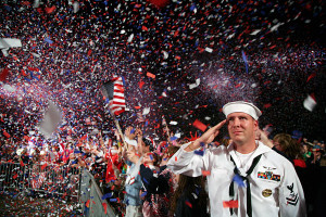 090704-N-3271W-343 BOSTON, Mass. (July 4, 2009) Mass Communication Specialist 2nd Class Scott Webb salutes as the American flag is presented on stage during the Boston Pops Fireworks Spectacular at the Charles River Esplanade. The nationally broadcast performance by the famous orchestra was the finale of scheduled events during Boston Harborfest and Boston Navy Week. Navy Weeks are designed to show Americans the investment they have made in their Navy and increase awareness in cities that do not have a significant Navy presence. (U.S. Navy photo by Senior Chief Mass Communication Specialist Gary Ward/Released)